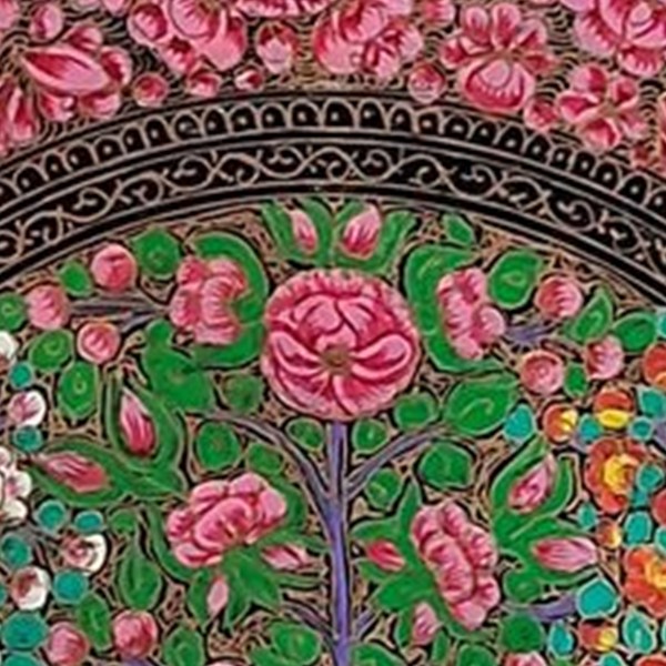 A large open gul-e-vilayat rose painted in pink and gold at the centre of a Kashmiri paper machie panel, ringed by smaller roses on a green ground.