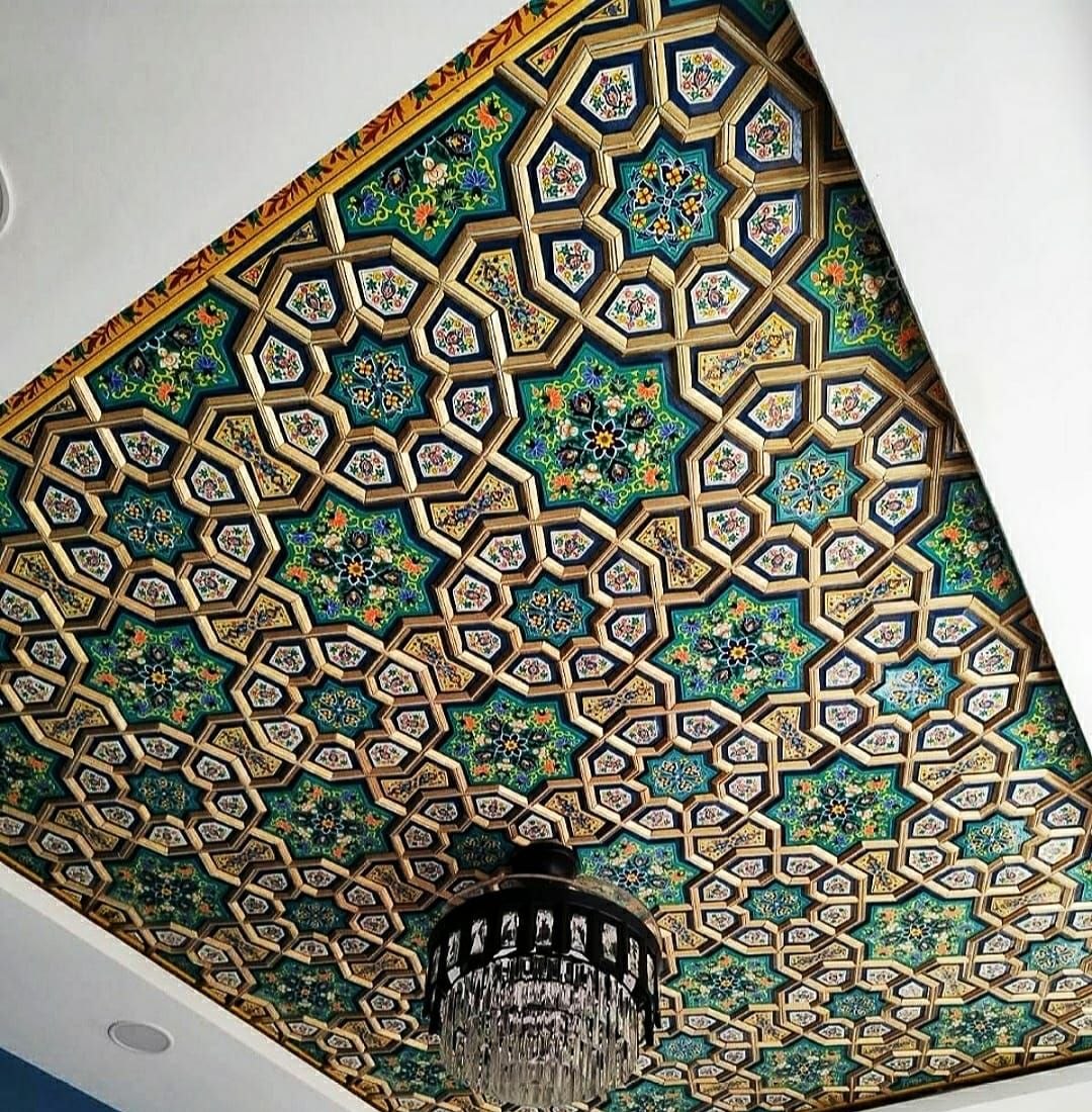 Khatamband ceiling of interlocking gold-ribbed stars with emerald and lapis painted paper machie panels.